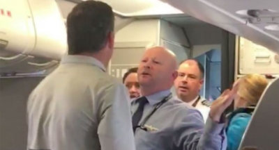 Asistente de vuelo de América Airlines desafía a pasajero a pegarle (VIDEO)