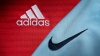 Los logotipos de Adidas y Nike en unas camisetas deportivas.