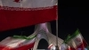 Ondeo de banderas iraníes ante el monumento de Azadi (Libertad) al oeste de Teherán, 29 de abril de 2026